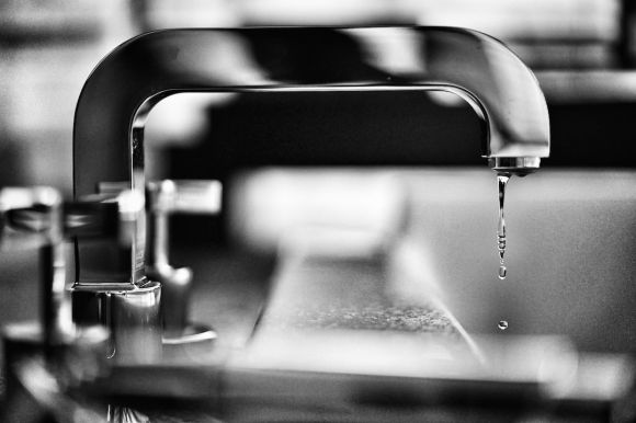 Plumbing - grayscale photography of faucet