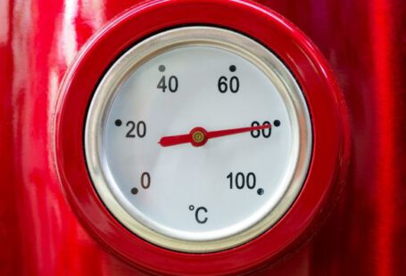 Hot Water - a close up of a thermometer on a red object