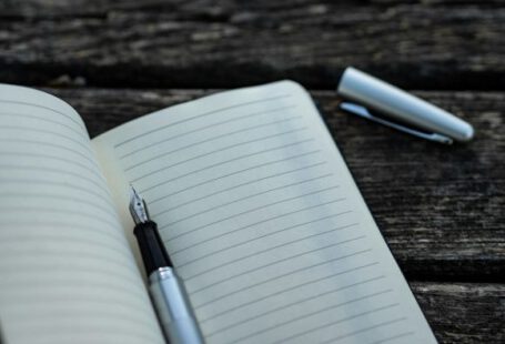 Checklist - gray and black fountain pen and book