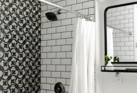 Shower - white shower curtain on stainless steel shower head