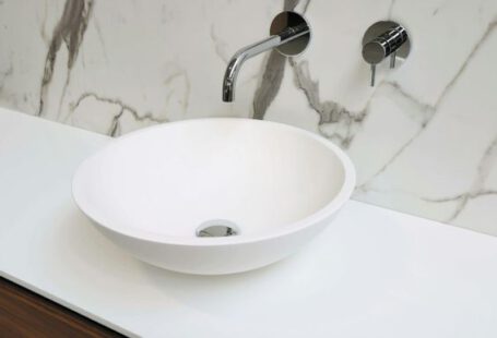 Sink - stainless steel faucet on white ceramic sink