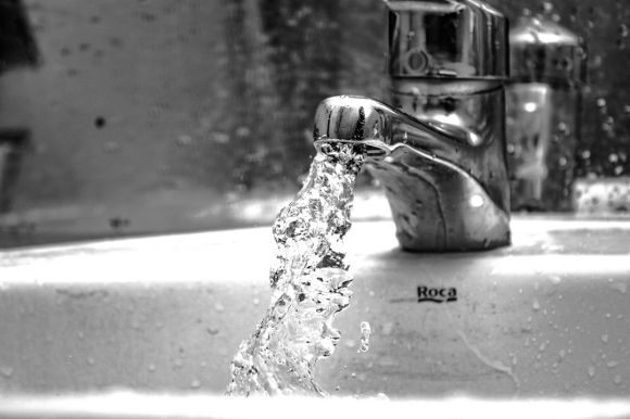 Faucet - water falling from faucet in grayscale photography