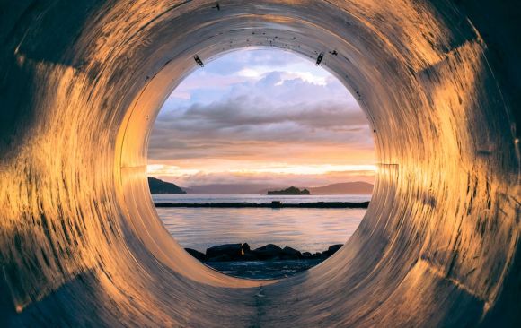 Pipe - body of water can be seen through the tunnel