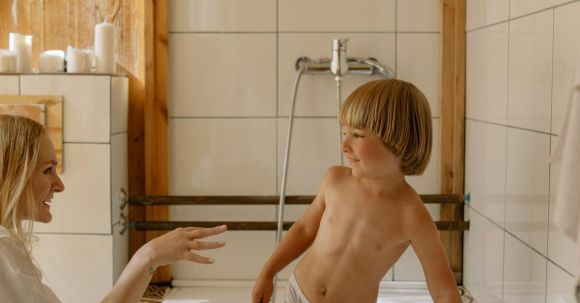 Bathroom Upgrades - Topless Boy in White Shorts Standing on White Ceramic Sink
