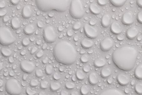 Water Leak - Water texture wet background of light gray color with transparent water drops of different sizes and shapes flowing down together